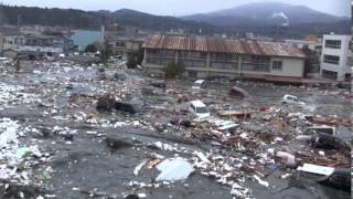 Tsunami in Kesennuma city ascending the Okawa river [upl. by Rosa]